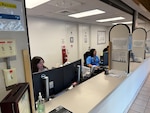 Rebecca Untalan, left, and Heather Chaparro, patient administration professionals at Branch Health Clinic Makalapa, provide support to incoming patients at the newly-integrated front desk. BHC Makalapa consolidated four previously separate check-in locations: Optometry, PCMH Gold and Red Teams, and Obstetrics and Gynecology, into a single, streamlined operation. The consolidation simplified the arrival process for patients, reallocated staff and enhanced clinical support, resulting in faster check-in times, improved Patient Information Profile verification, and higher patient satisfaction.