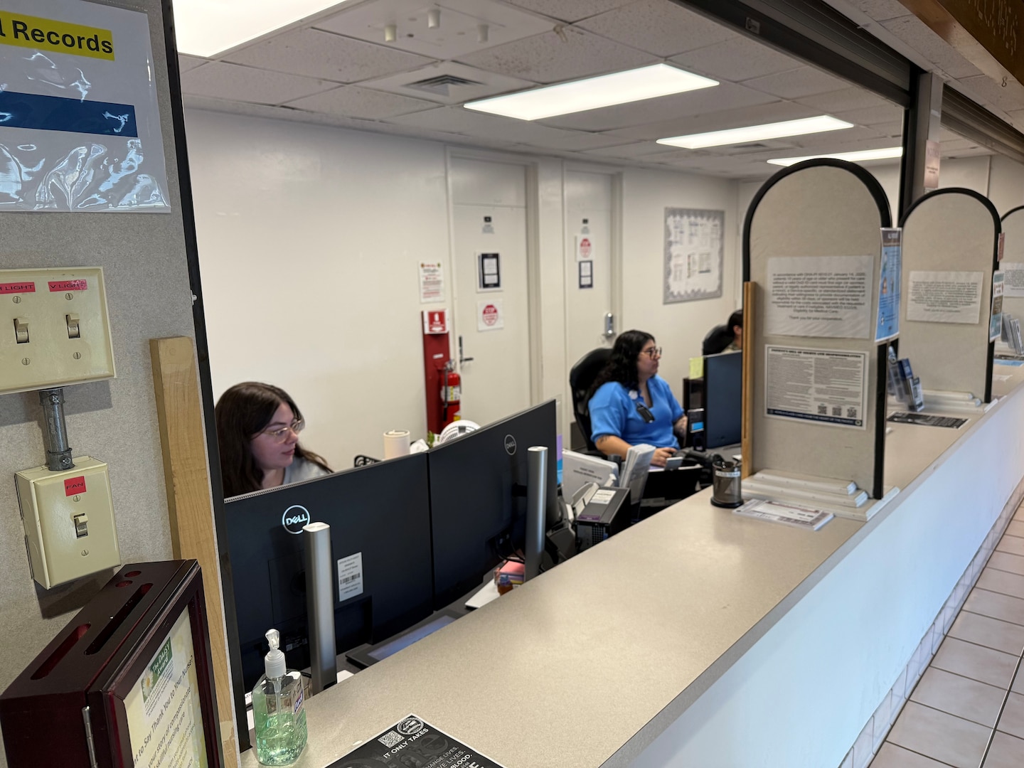 Rebecca Untalan, left, and Heather Chaparro, patient administration professionals at Branch Health Clinic Makalapa, provide support to incoming patients at the newly-integrated front desk. BHC Makalapa consolidated four previously separate check-in locations: Optometry, PCMH Gold and Red Teams, and Obstetrics and Gynecology, into a single, streamlined operation. The consolidation simplified the arrival process for patients, reallocated staff and enhanced clinical support, resulting in faster check-in times, improved Patient Information Profile verification, and higher patient satisfaction.
