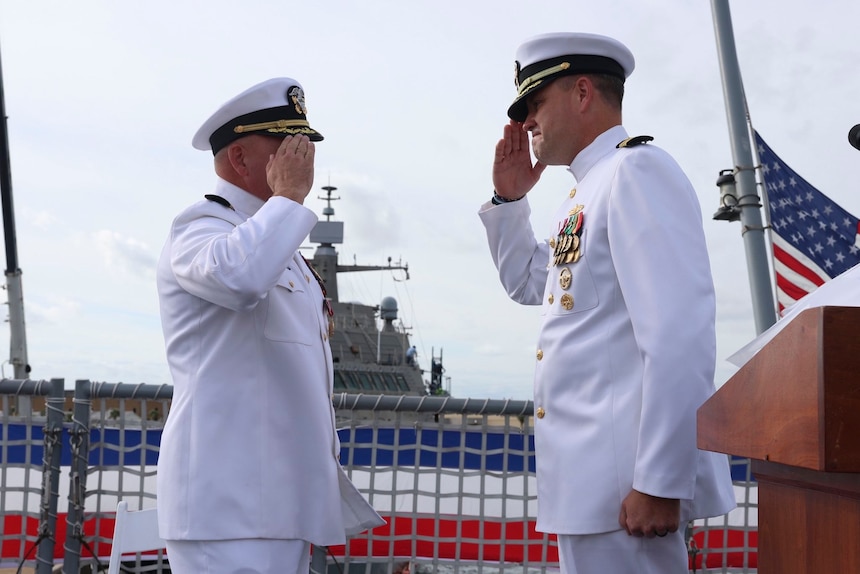250912-N-ZZ999-1007 MAYPORT, Fla. (Sept. 12, 2025) – Incoming commodore of Littoral Combat Ship Squadron Two (LCSRON 2) Capt. Wade Smith salutes and officially relieves Capt. Mark Haney during LCSRON 2’s change of command ceremony aboard USS Beloit (LCS 29), onboard Naval Station Mayport, Sept. 12. (U.S. Navy Courtesy Photo)