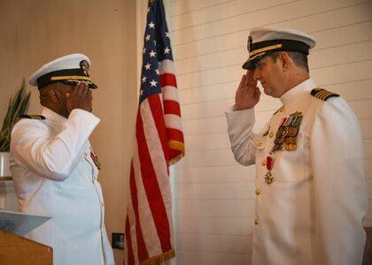 250912-N-OZ224-1006 MAYPORT, Fla. (Sept. 12, 2025) – Oncoming commodore of Commander, Naval Surface Group Southeast (CNSG SE) Capt. Anthony James, left, relieves Capt. Aaron Anderson during CNSG SE’s change of command ceremony onboard Naval Station Mayport, Sept. 12. (U.S. Navy photo by Mass Communication Specialist 1st Class Brandon J. Vinson)