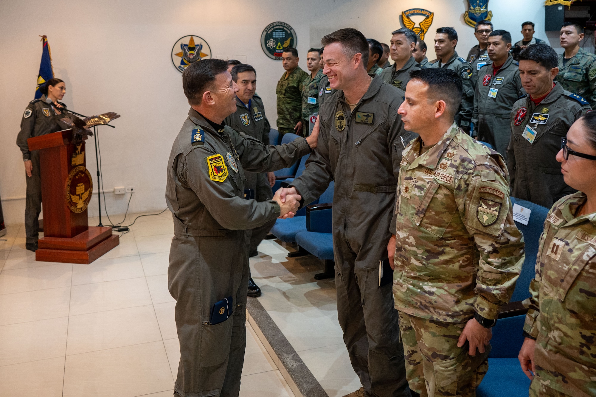 U.S. Air Force Lt. Col. Phillip Vaughn, Expeditionary Task Group commander (SOCSOUTH), meets Brig. Gen. Luis Fierro Urresta, commander of Air and Space Command (COAE), during the Air to Ground Integration opening ceremony in Guayaquil, Ecuador, for a Subject Matter Expert Exchange on August 25, 2025. Special Operations Command South (SOCSOUTH) conducts activities such as this exchange to strengthen relationships with partner nations and enhance their security capabilities.   (U.S. Air Force photo by Master Sgt. Erica Campbell)