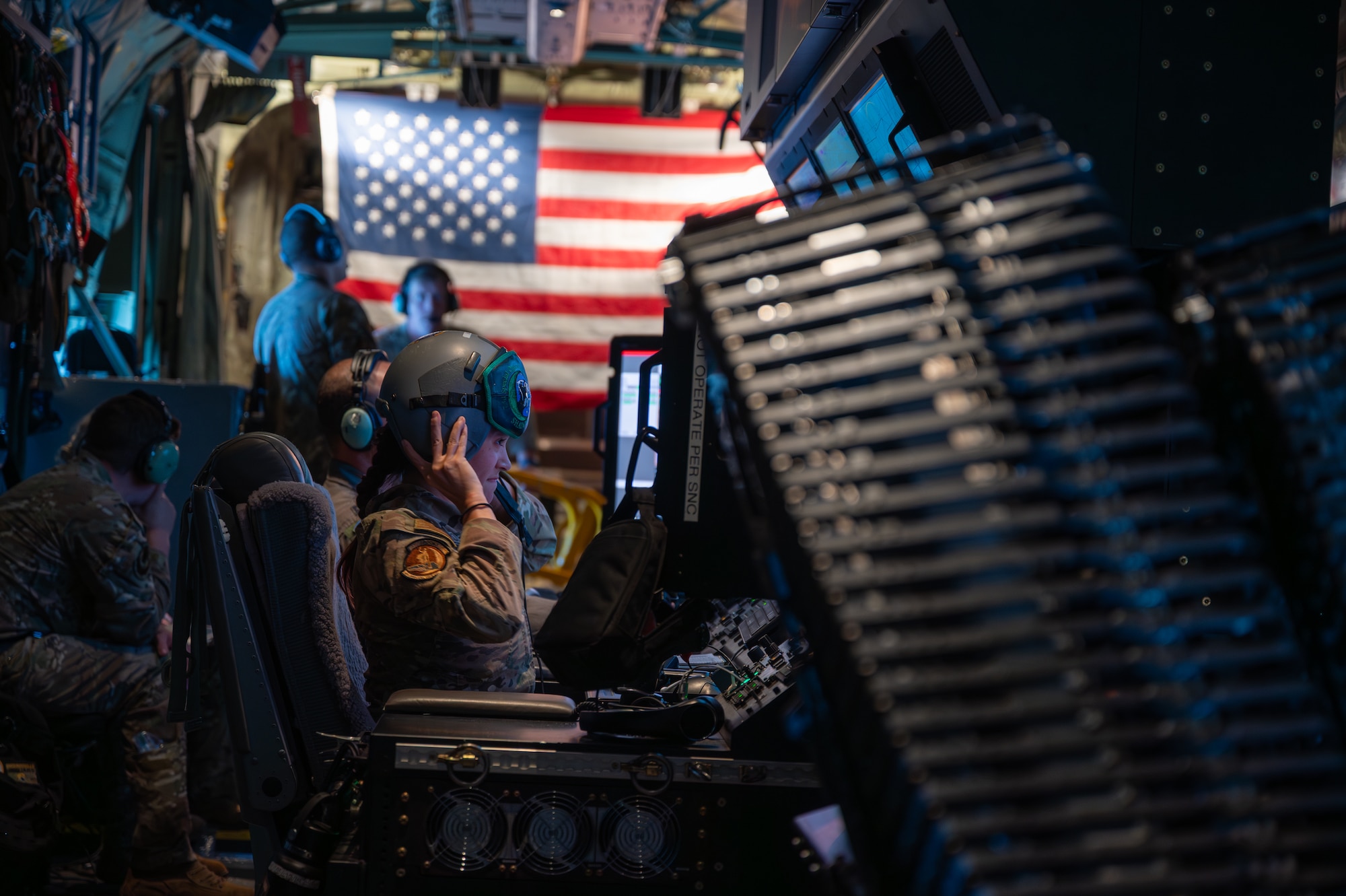 A U.S. Air Force weapon systems officer assigned to the 1st Special Operations Wing dons a helmet to prepare for a live-fire exercise near Hurlburt Field, Florida, Sept. 11, 2025. 