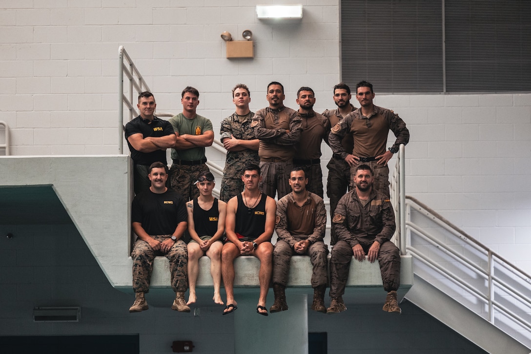 U.S. Marines and a Navy Sailor with the 26th Marine Expeditionary Unit and Reconnaissance marines with Infantería de Marina (Spanish marine corps) pose for a photo after completing water survival training as part of UNITAS 2025 at Marine Corps Base Camp Lejeune, North Carolina, Sep. 15, 2025. UNITAS, which is Latin for “unity,” was conceived in 1959 and has taken place annually since first conducted in 1960. This marks the 66th iteration of the world’s longest running annual multinational maritime exercise. (U.S. Marine Corps photo by Sgt. Jorge Borjas)