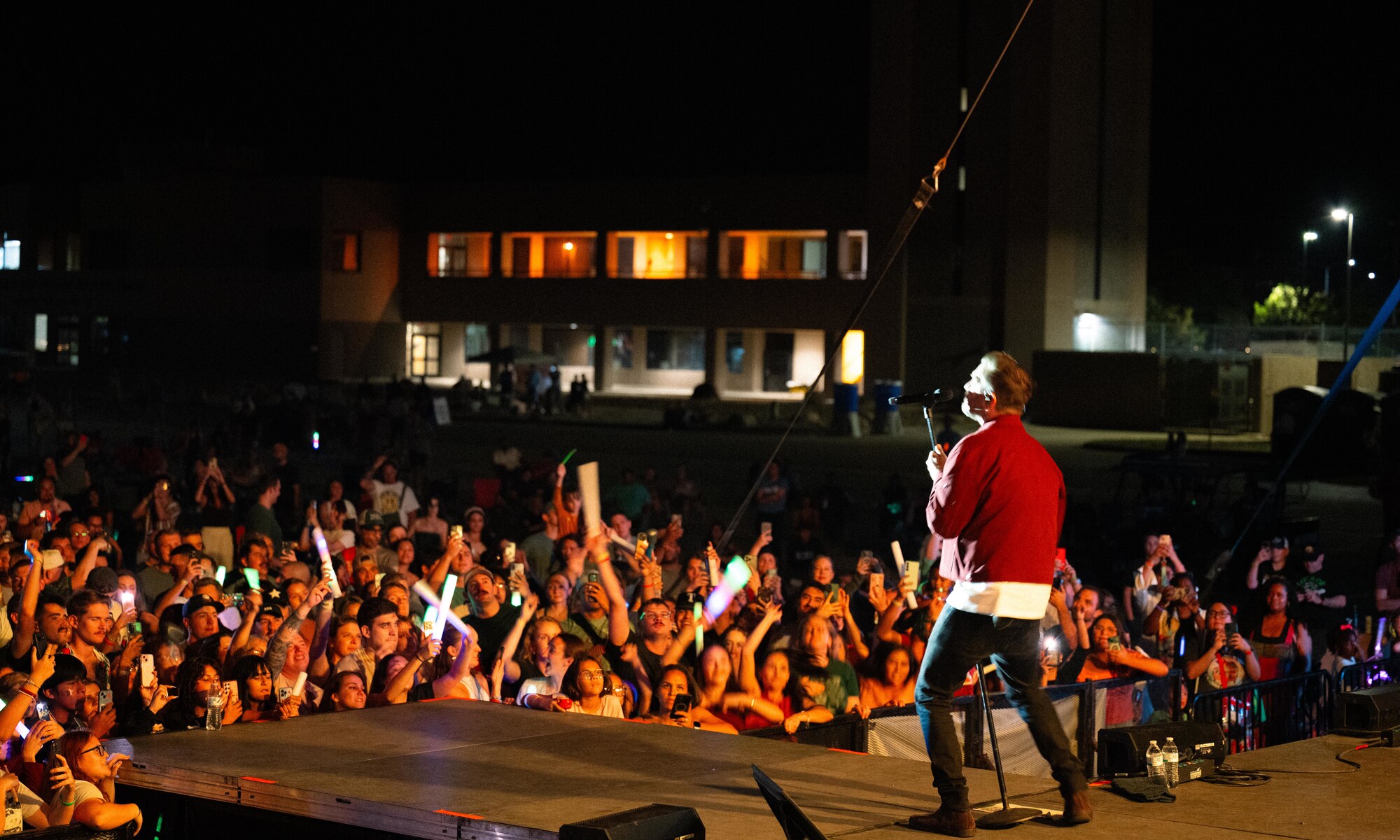 Andy Grammer energizes the audience at Summer Bash, Laughlin Air Force Base, Texas, Sept. 12, 2025. The concert served as a morale booster for the base community, offering a well-deserved break from daily operations. (U.S. Air Force photo by Airman 1st Class Harrison Sullivan)