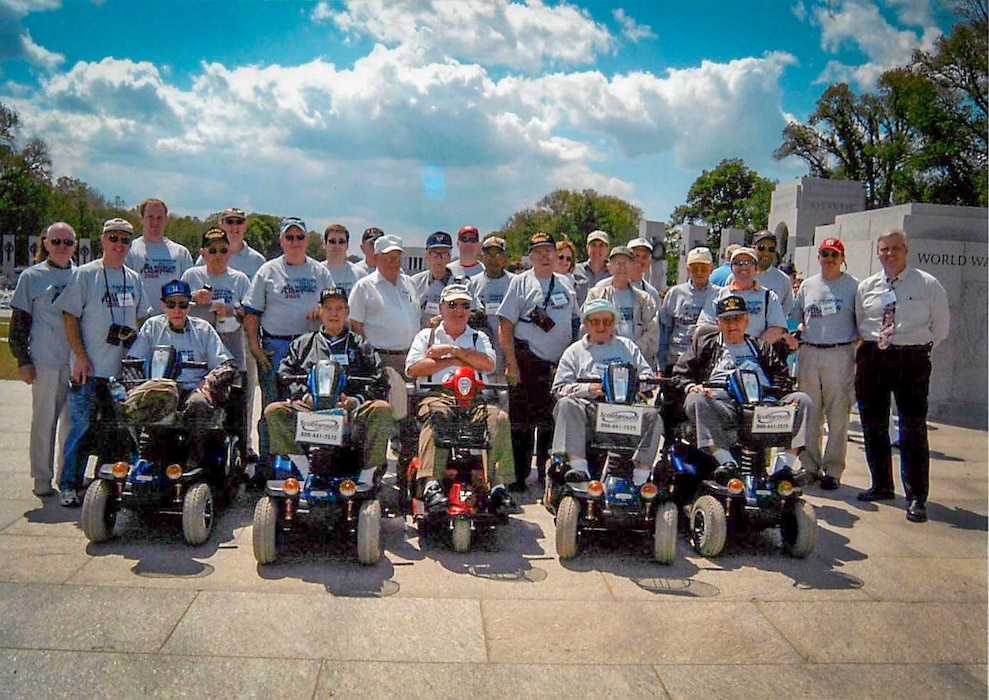 Retired U.S. Air Force Capt. Earl Morse, one of the founders of Honor Flight, stands with World War II veterans and volunteer pilots at the National World War II Memorial in Washington, D.C., May 21, 2005. The photo captures the very first Honor Flight, composed solely of veterans, the pilots and those who served as guardians, marking the beginning of a nationwide movement to honor America’s aging heroes. (Courtesy photo from Morse)