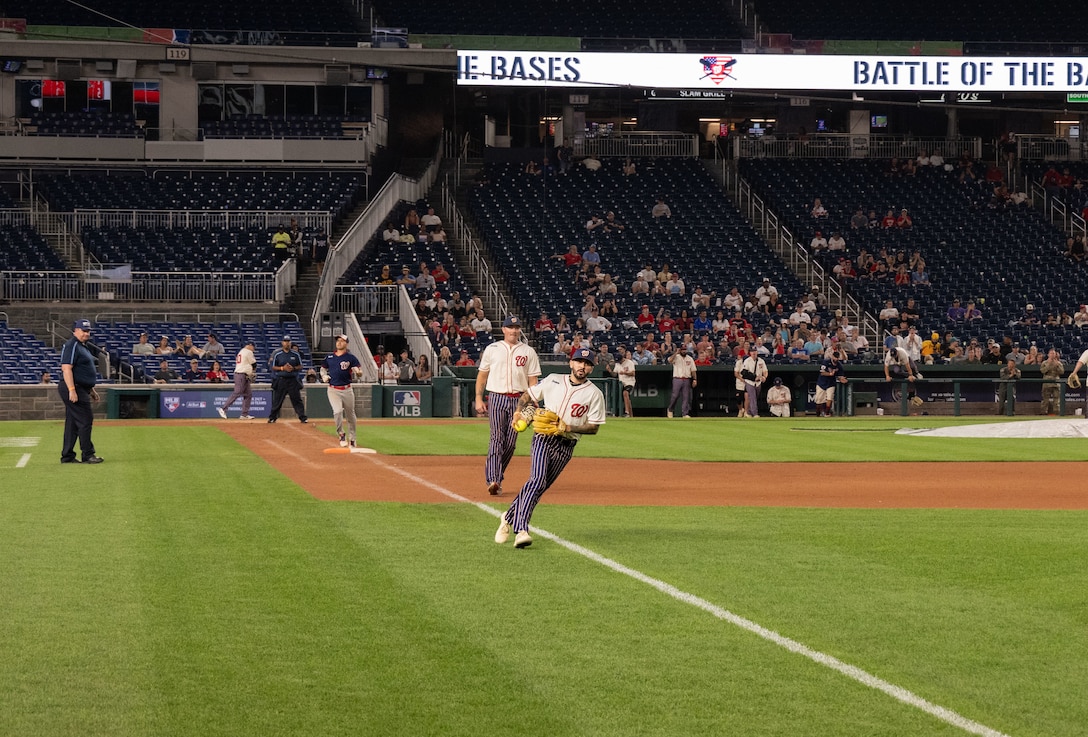 The Joint Base Andrews softball team plays against Marine Corps Base Quantico during the championship game of Battle of the Bases at Nationals Park, Washington, D.C., Sept. 13, 2025.