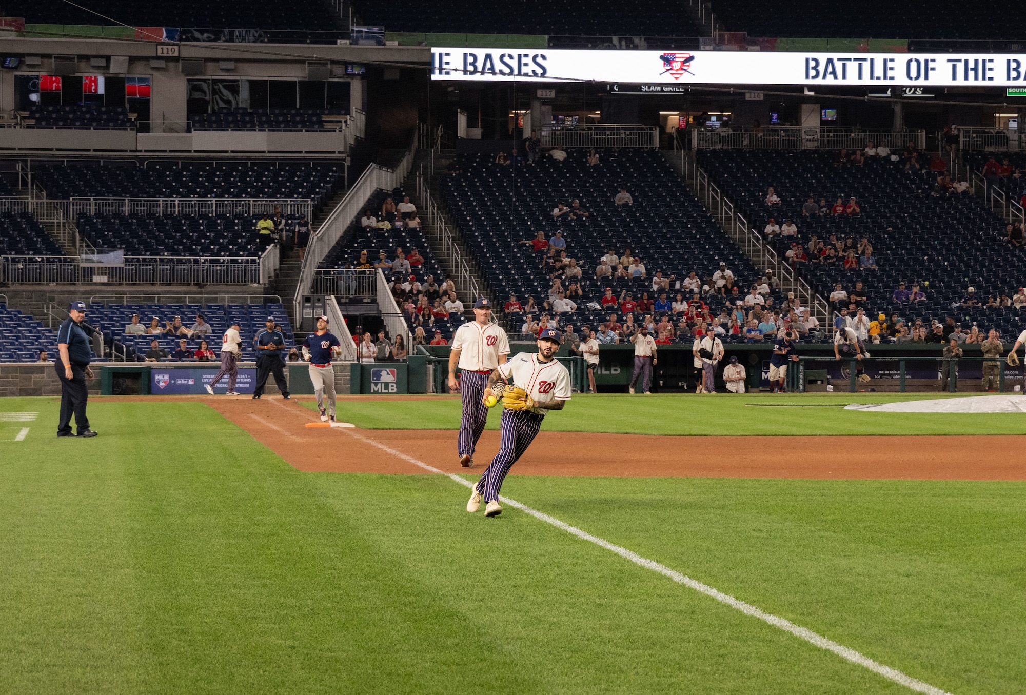 The Joint Base Andrews softball team plays against Marine Corps Base Quantico during the championship game of Battle of the Bases at Nationals Park, Washington, D.C., Sept. 13, 2025.