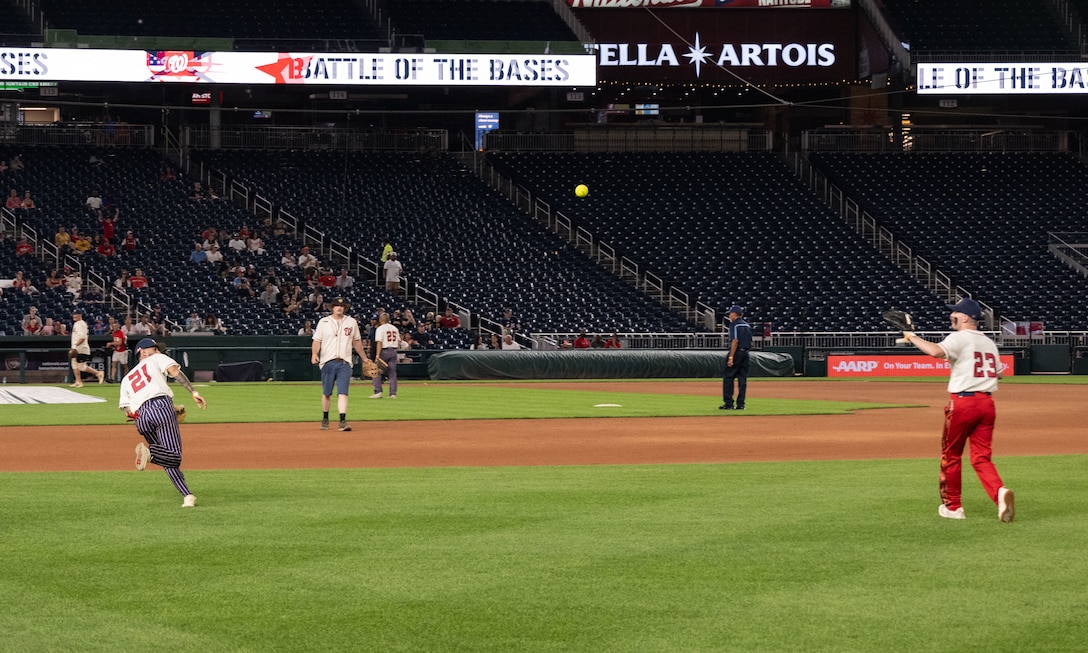 The Joint Base Andrews softball team plays against Marine Corps Base Quantico during the championship game of Battle of the Bases at Nationals Park, Washington, D.C., Sept. 13, 2025.