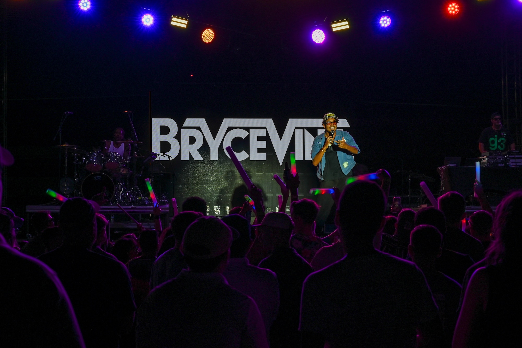 Bryce Vine, a headlining artist with Armed Forces Entertainment, performs during Summer Bash at Laughlin Air Force Base, Texas, Sept. 15, 2025. The event featured food trucks, vendors, a kid zone, and live performances from Andy Grammer, Bryce Vine and 3OH!3. (U.S. Air Force photo by Senior Airman Jarrett Smith)