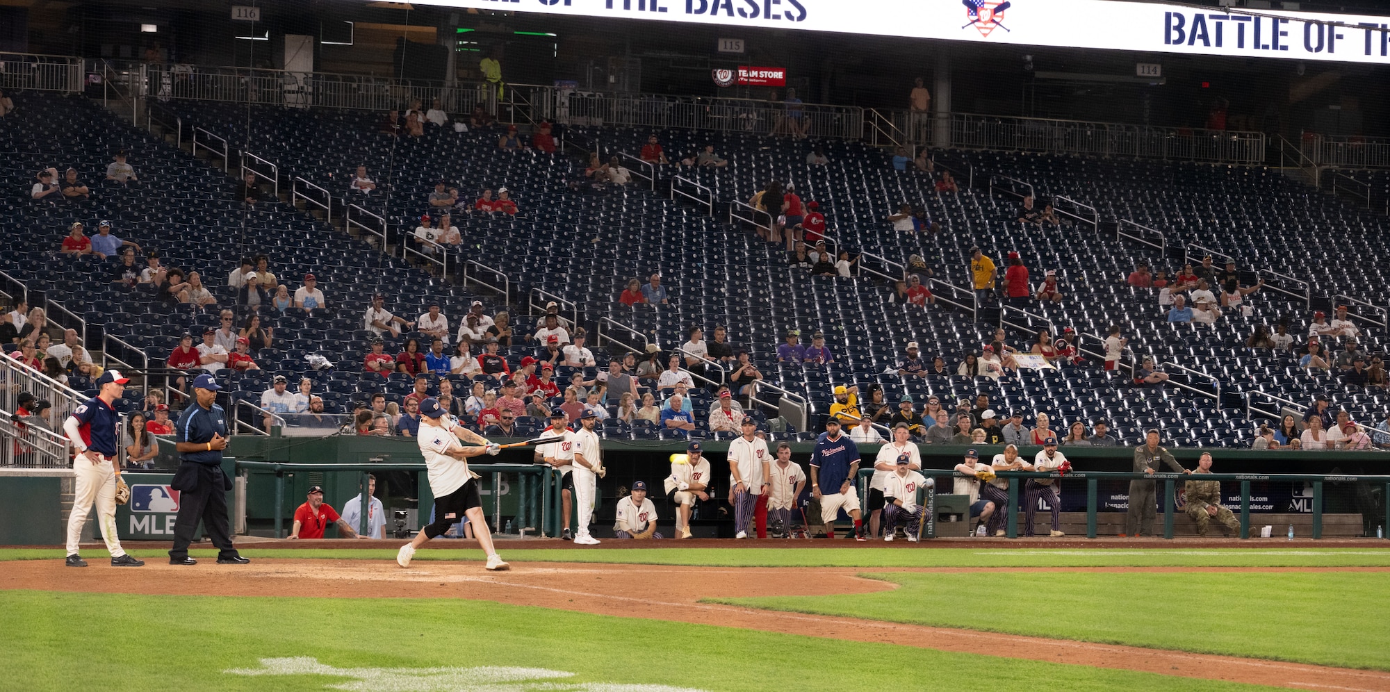 A member of the Joint Base Andrews softball team hits a pitch during the championship game of Battle of the Bases at Nationals Park, Washington, D.C., Sept. 13, 2025.
