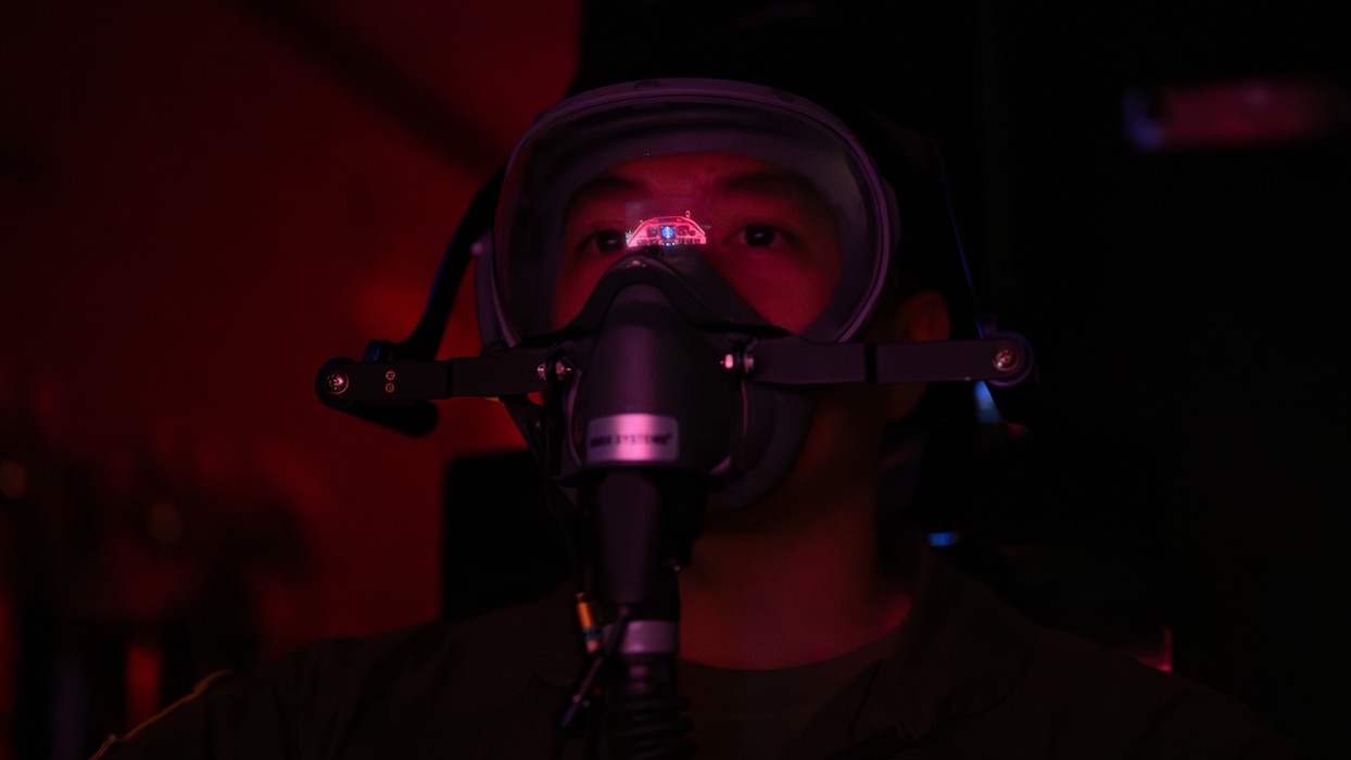 A tight shot of an Airman's face while he wears a mask