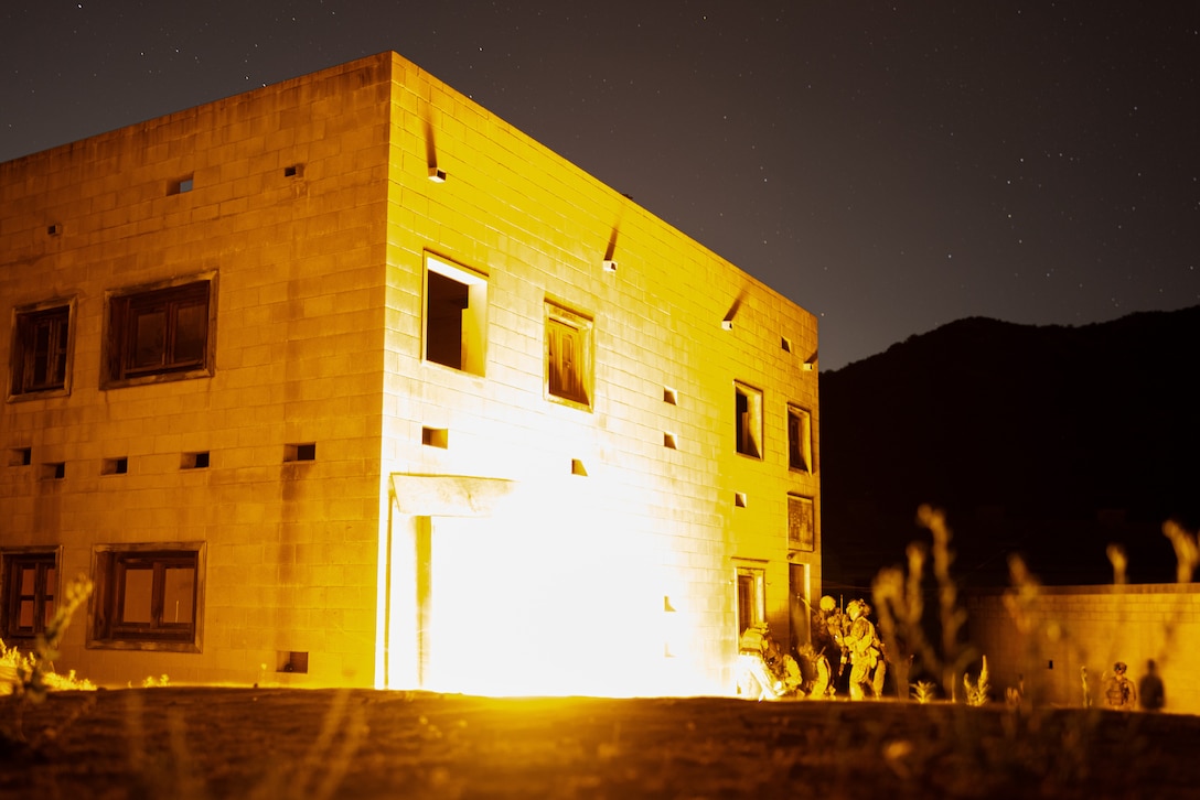 U.S. Marines with Battalion Landing Team 3/5, 11th Marine Expeditionary Unit, breach a building during a nighttime raid as part of Raid Leaders Course 25-4 hosted by Expeditionary Operations Training Group, I Marine Expeditionary Force, on Marine Corps Base Camp Pendleton, California, Sept. 11, 2025.