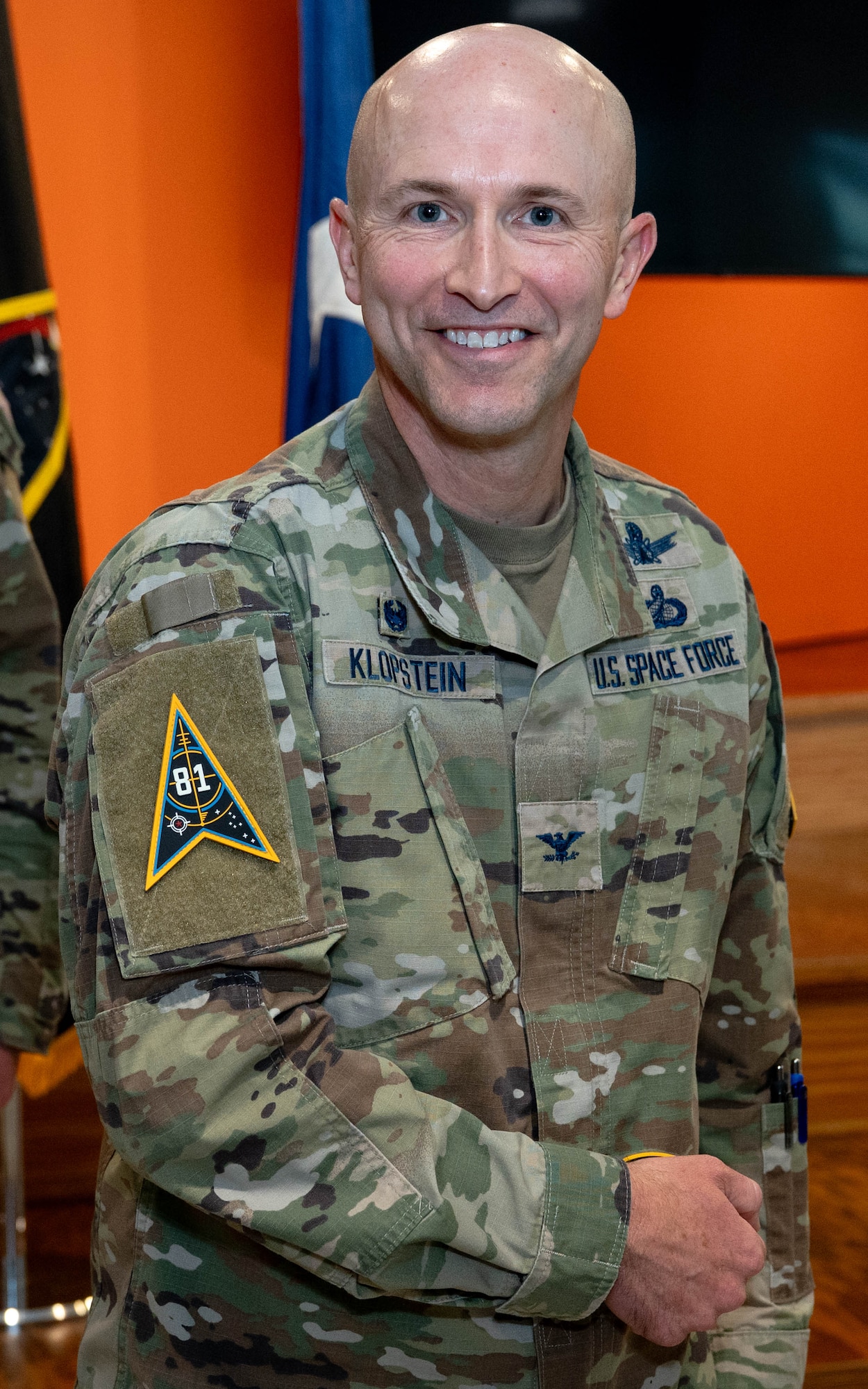 USSF Col. Corey Klopstein, SSC System Delta (SYD) 81 commander, poses for a photo after receiving a unit patch commemorating his assumption of command for the newest U.S. Space Force Space Systems Command SYD 81, at a ceremony on Sept. 9, 2025. (USAF Photo by Senior Airman William Pugh)