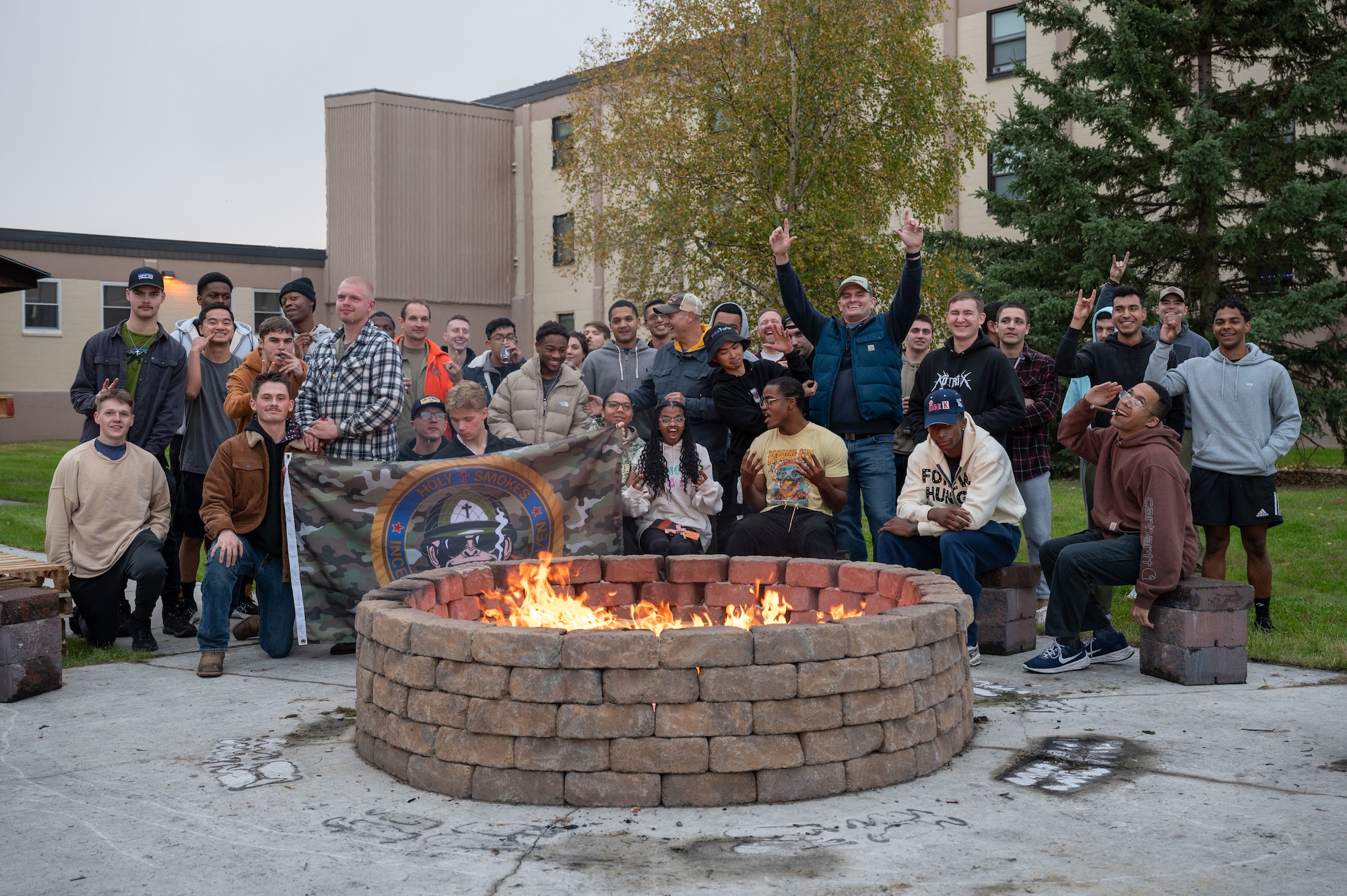 Airmen assigned to the 354th Fighter Wing celebrate in a group photo for the one-year anniversary of Holy Smokes at Eielson Air Force Base, Alaska, Sept. 12, 2025.