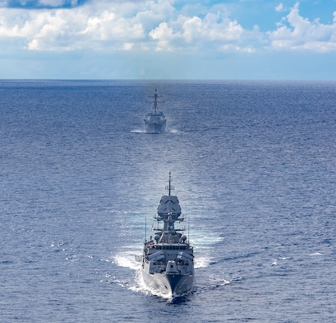 Arleigh Burke-class guided-missile destroyer USS Dewey (DDG 105), back, sails alongside Anzac-class frigate HMAS Ballarat (FFH 155), front, during a bilateral training with the Royal Australian Navy in the South China Sea, Sept. 16, 2025.