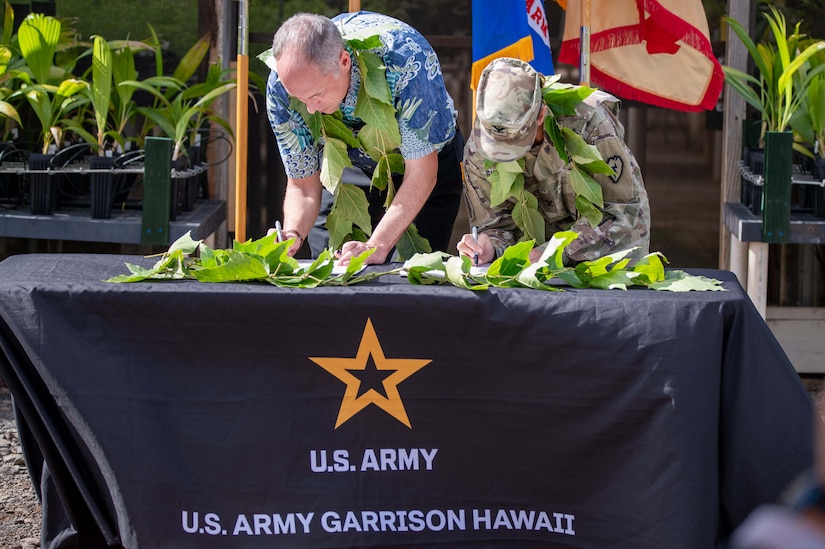 Dr. Chad Walton, University of Hawai‘i System interim vice president for research and innovation, left, and Col. Rachel Sullivan, commander of U.S. Army Garrison Hawai‘i, sign an intergovernmental support agreement Sept. 16, 2025 at the Schofield Barracks Seed Lab that expands environmental services, boosts conservation workforce development and strengthens island resilience.