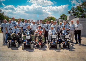 Retired U.S. Air Force Capt. Earl Morse, one of the founders of Honor Flight, stands with World War II veterans and volunteer pilots at the National World War II Memorial in Washington, D.C., May 21, 2005. The photo captures the very first Honor Flight, composed solely of veterans, the pilots and those who served as guardians, marking the beginning of a nationwide movement to honor America’s aging heroes. (Courtesy photo from Morse)