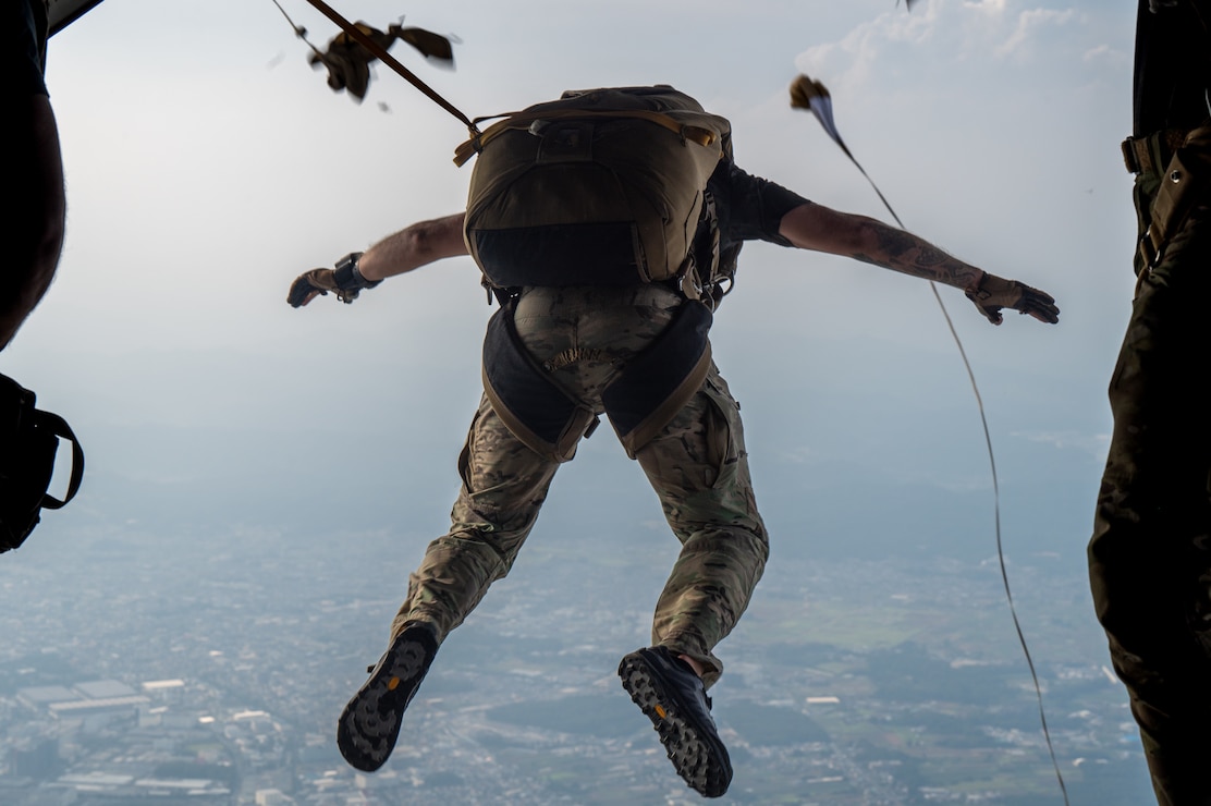 A U.S. Air Force pararescueman assigned to the 31st Rescue Squadron, jumps off a C-130J Super Hercules assigned to the 36th Airlift Squadron, above Yokota Air Base, Japan, Aug. 27, 2025.