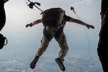 A U.S. Air Force pararescueman assigned to the 31st Rescue Squadron, jumps off a C-130J Super Hercules assigned to the 36th Airlift Squadron, above Yokota Air Base, Japan, Aug. 27, 2025.