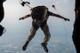 A U.S. Air Force pararescueman assigned to the 31st Rescue Squadron, jumps off a C-130J Super Hercules assigned to the 36th Airlift Squadron, above Yokota Air Base, Japan, Aug. 27, 2025.