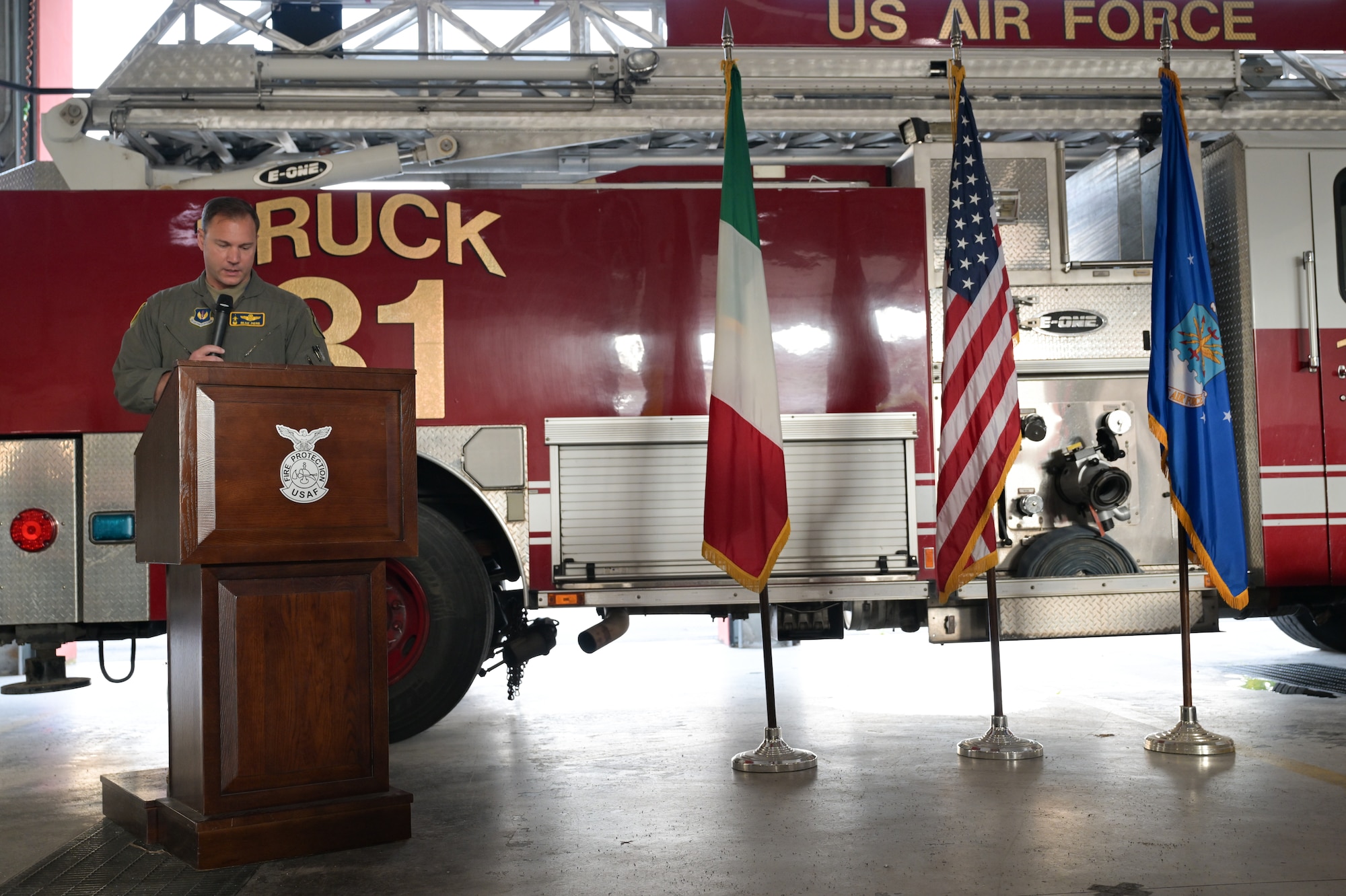 U.S. Air Force Col. Beau Diers, 31st Fighter Wing commander, speaks during the 9/11 Ceremony held at the 31st Civil Engineer Squadron fire department at Aviano Air Base, Italy, Sept. 11, 2025.