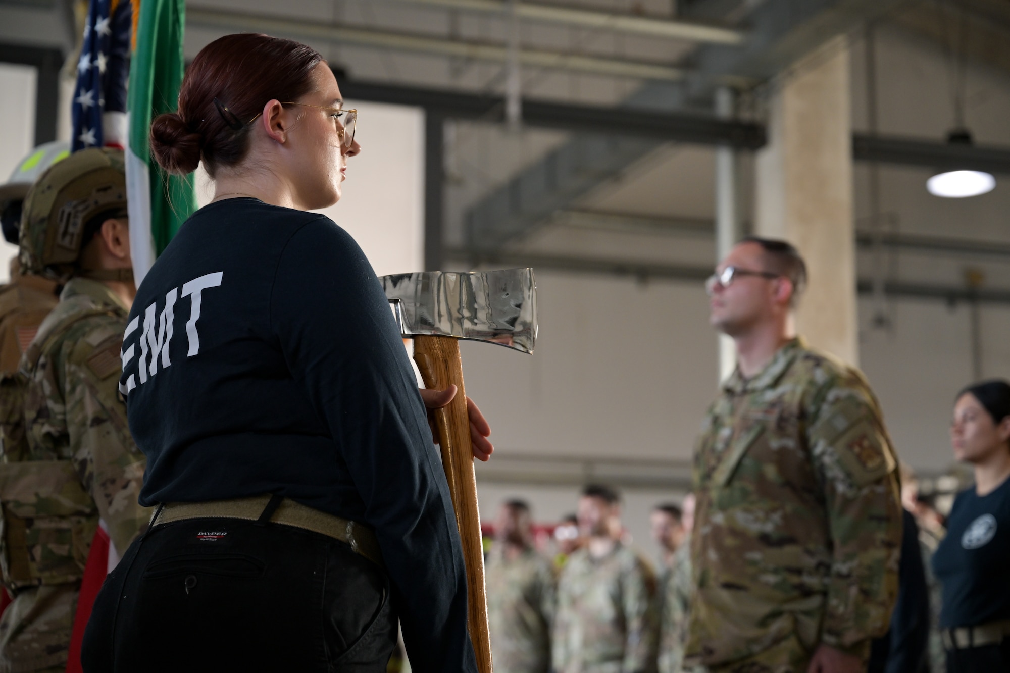 U.S. Air Force Senior Airman Rachel Matlack-Grey, 31st Medical Group emergency medical technician, posts during the presentation of the colors at the 9/11 Ceremony held at he 31st Civil Engineer Squadron fire department at Aviano Air base, Italy, Sept. 11, 2025.