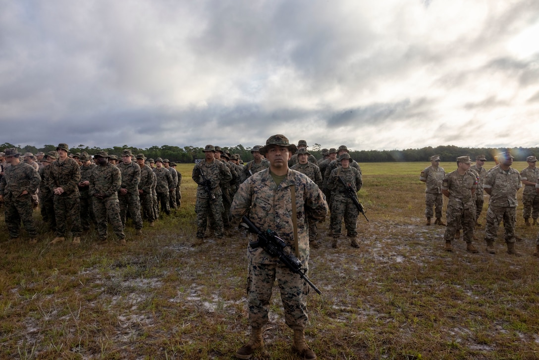 U.S. Marines with Combat Logistics Battalion 22, and 2nd Battalion 2nd Marine Regiment, stand in formation at the opening ceremony of exercise UNITAS 2025, Marine Corps Base Camp Lejeune, North Carolina, Sep. 16, 2025. UNITAS, which is Latin for “unity,” was conceived in 1959 and has taken place annually since first conducted in 1960. This year marks the 66th iteration of the world’s longest running annual multinational maritime exercise. (U.S. Marine Corps photo by Lance Cpl. Payton Goodrich)