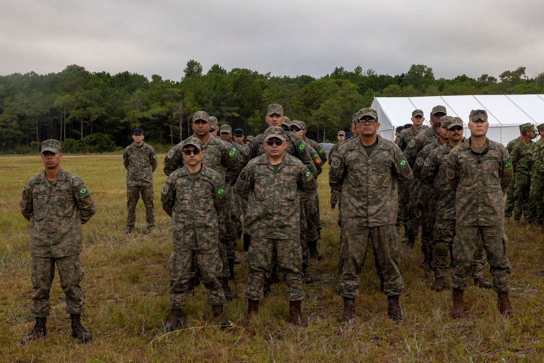 Corpo de Fuzileiros Navais (Brazilian marine corps) stand in formation at the opening ceremony of exercise UNITAS 2025, Marine Corps Base Camp Lejeune, North Carolina, Sep. 16, 2025. UNITAS, which is Latin for “unity,” was conceived in 1959 and has taken place annually since first conducted in 1960. This year marks the 66th iteration of the world’s longest running annual multinational maritime exercise. (U.S. Marine Corps photo by Lance Cpl. Payton Goodrich)