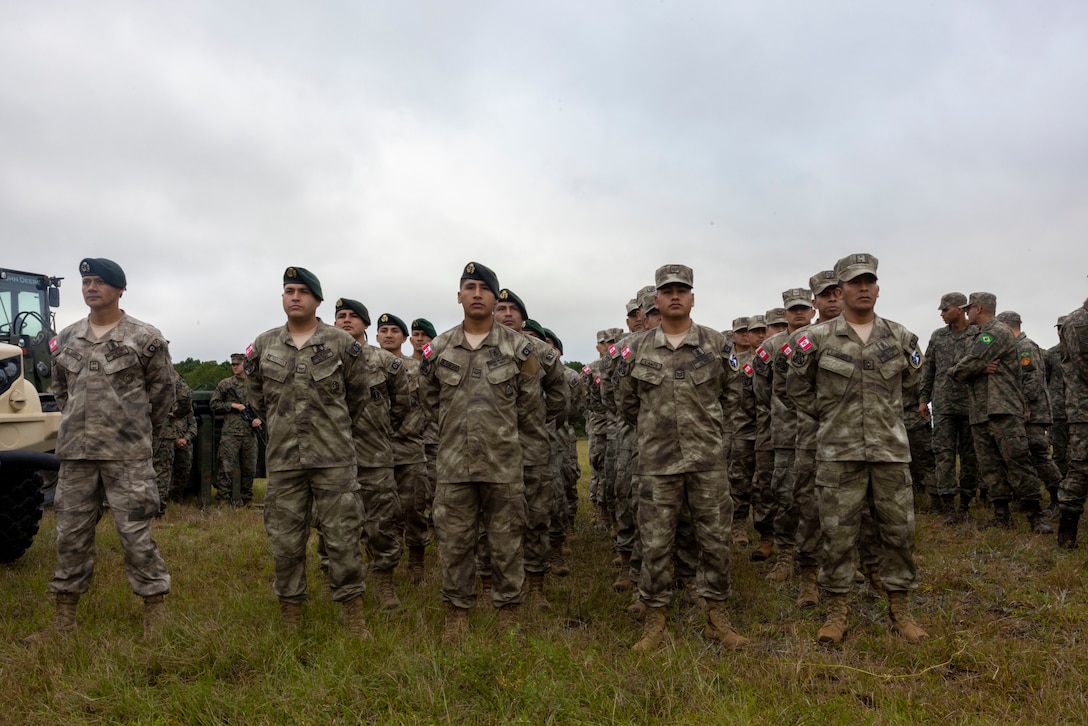 Marines with Infantería de Marina del Perú (Peruvian Naval Infantry), stand in formation at the opening ceremony of exercise UNITAS 2025, Marine Corps Base Camp Lejeune, North Carolina, Sep. 16, 2025. UNITAS, which is Latin for “unity,” was conceived in 1959 and has taken place annually since first conducted in 1960. This year marks the 66th iteration of the world’s longest running annual multinational maritime exercise. (U.S. Marine Corps photo by Lance Cpl. Payton Goodrich)