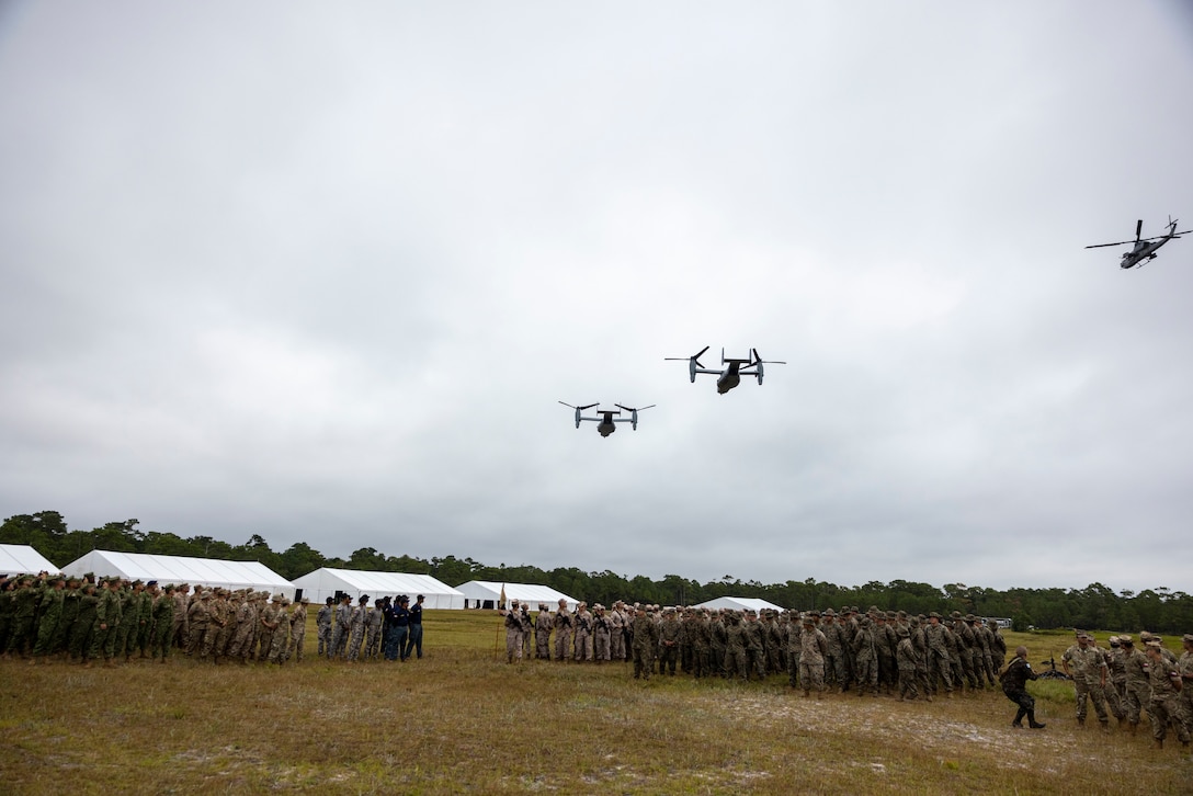 U.S. Marine Corps V-22 Ospreys, fly over the opening ceremony of exercise UNITAS 2025, Marine Corps Base Camp Lejeune, North Carolina, Sep. 16, 2025. UNITAS, which is Latin for “unity,” was conceived in 1959 and has taken place annually since first conducted in 1960. This year marks the 66th iteration of the world’s longest running annual multinational maritime exercise. (U.S. Marine Corps photo by Lance Cpl. Payton Goodrich)