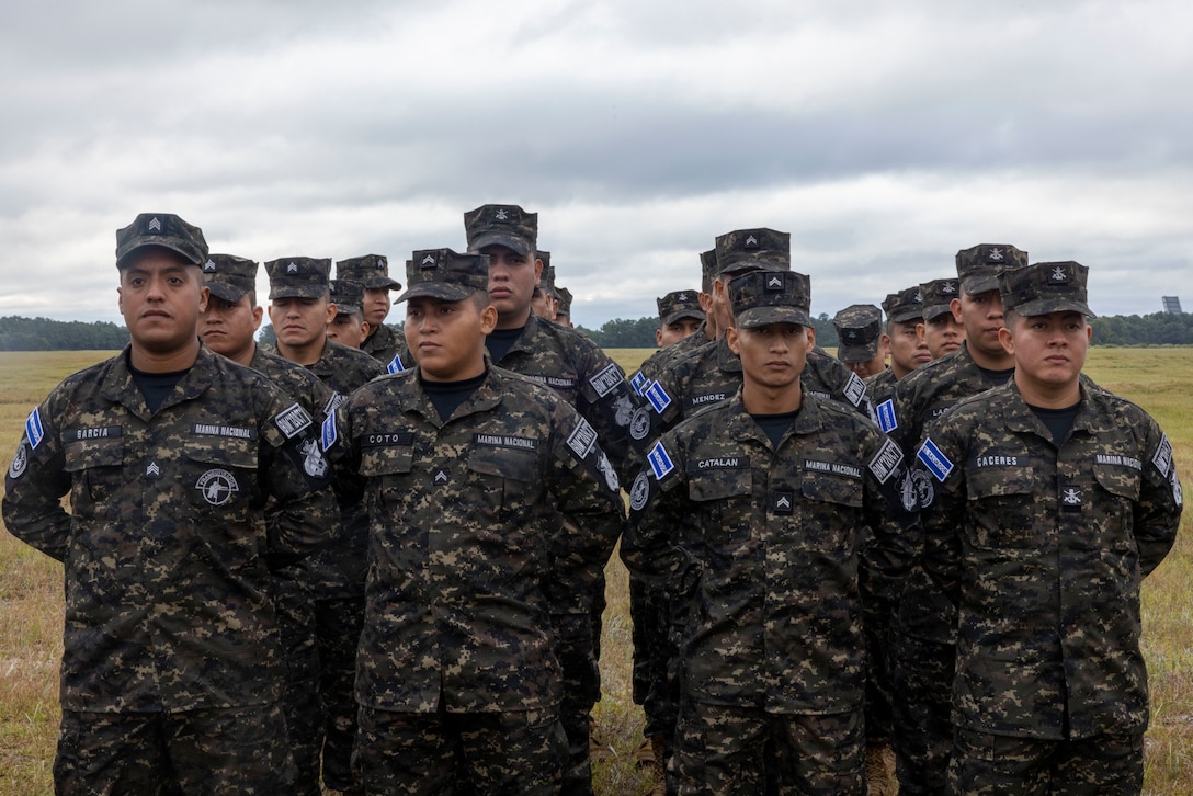 Marines with Fuerza Naval de El Salvador, Batallón de Infantería de Marina, (El Salvador marine infantry battalion) stand in formation at the opening ceremony of exercise UNITAS 2025, Marine Corps Base Camp Lejeune, North Carolina, Sep. 16, 2025. UNITAS, which is Latin for “unity,” was conceived in 1959 and has taken place annually since first conducted in 1960. This year marks the 66th iteration of the world’s longest running annual multinational maritime exercise. (U.S. Marine Corps photo by Lance Cpl. Payton Goodrich)