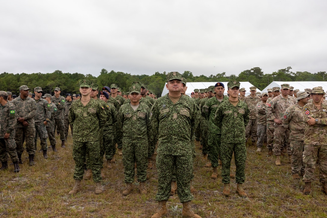 Marines with Infantería de Marina Colombiana (Colombian marine corps) stand in formation at the opening ceremony of exercise UNITAS 2025, Marine Corps Base Camp Lejeune, North Carolina, Sep. 16, 2025. UNITAS, which is Latin for “unity,” was conceived in 1959 and has taken place annually since first conducted in 1960. This year marks the 66th iteration of the world’s longest running annual multinational maritime exercise. (U.S. Marine Corps photo by Lance Cpl. Payton Goodrich)