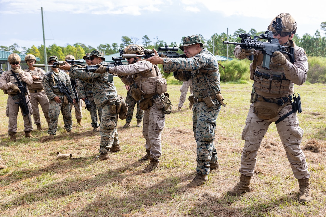 U.S. Marines and Infanteria de Marina (Spanish marines) practice weapons manipulation techniques during Exercise UNITAS 25 at Camp Lejeune, North Carolina, Sept. 15, 2025. UNITAS, which is Latin for “unity,” was conceived in 1959 and has taken place annually since first conducted in 1960. This year marks the 66th iteration of the world’s longest running annual multinational maritime exercise. The exercise trains forces in joint maritime operations that enhance tactical proficiency and increase interoperability with the presence of unmanned air, surface and submarine systems. (U.S. Marine Corps photo by Sgt. Eduardo Delatorre)