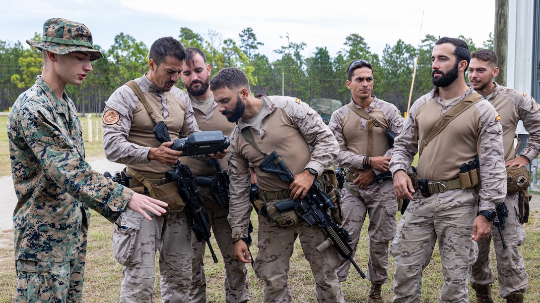 U.S. Marines and marines with Infanteria de Marina (Spanish marine corps) discuss the capabilities of drones during Exercise UNITAS 25 at Camp Lejeune, North Carolina, Sept. 15, 2025. UNITAS, which is Latin for “unity,” was conceived in 1959 and has taken place annually since first conducted in 1960. This year marks the 66th iteration of the world’s longest running annual multinational maritime exercise. The exercise trains forces in joint maritime operations that enhance tactical proficiency and increase interoperability with the presence of unmanned air, surface and submarine systems. (U.S. Marine Corps photo by Sgt. Eduardo Delatorre)