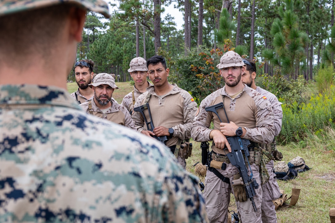 U.S. Marines and marines with Infanteria de Marina (Spanish marine corps) discuss the capabilities of drones during Exercise UNITAS 25 at Camp Lejeune, North Carolina, Sept. 15, 2025. UNITAS, which is Latin for “unity,” was conceived in 1959 and has taken place annually since first conducted in 1960. This year marks the 66th iteration of the world’s longest running annual multinational maritime exercise. The exercise trains forces in joint maritime operations that enhance tactical proficiency and increase interoperability with the presence of unmanned air, surface and submarine systems. (U.S. Marine Corps photo by Sgt. Eduardo Delatorre)