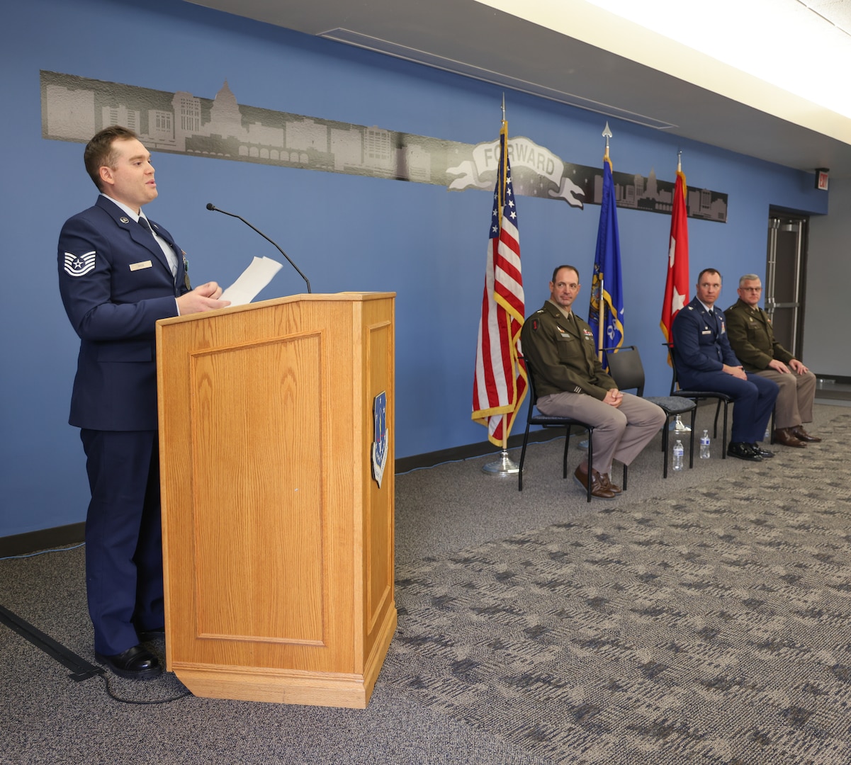 U.S. Air Force Tech. Sgt. Edward Wick, a munitions controller with the 115th Fighter Wing, Wisconsin Air National Guard, gives a speech at his ceremony to accept the 2024 1st. Lt. Thomas E. Wortham IV Achievement Award at Truax Field in Madison, Wisconsin, Sept. 11, 2025. Wick received the award for excellence in his community and his military service through mentorship and commitment to others. (U.S. Air National Guard photo by Staff Sgt. Olivia Sherman)