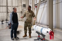 U.S. Air Force SMSgt. Mackenzie Wright, 5th Maintenance Group weapons standardization superintendent, gives a tour of munitions to Rep. Ed Case at Minot Air Force Base, North Dakota, Sept. 13, 2025. Visits like these are important because members of Congress often rely on their insights and recommendations when shaping key legislation.