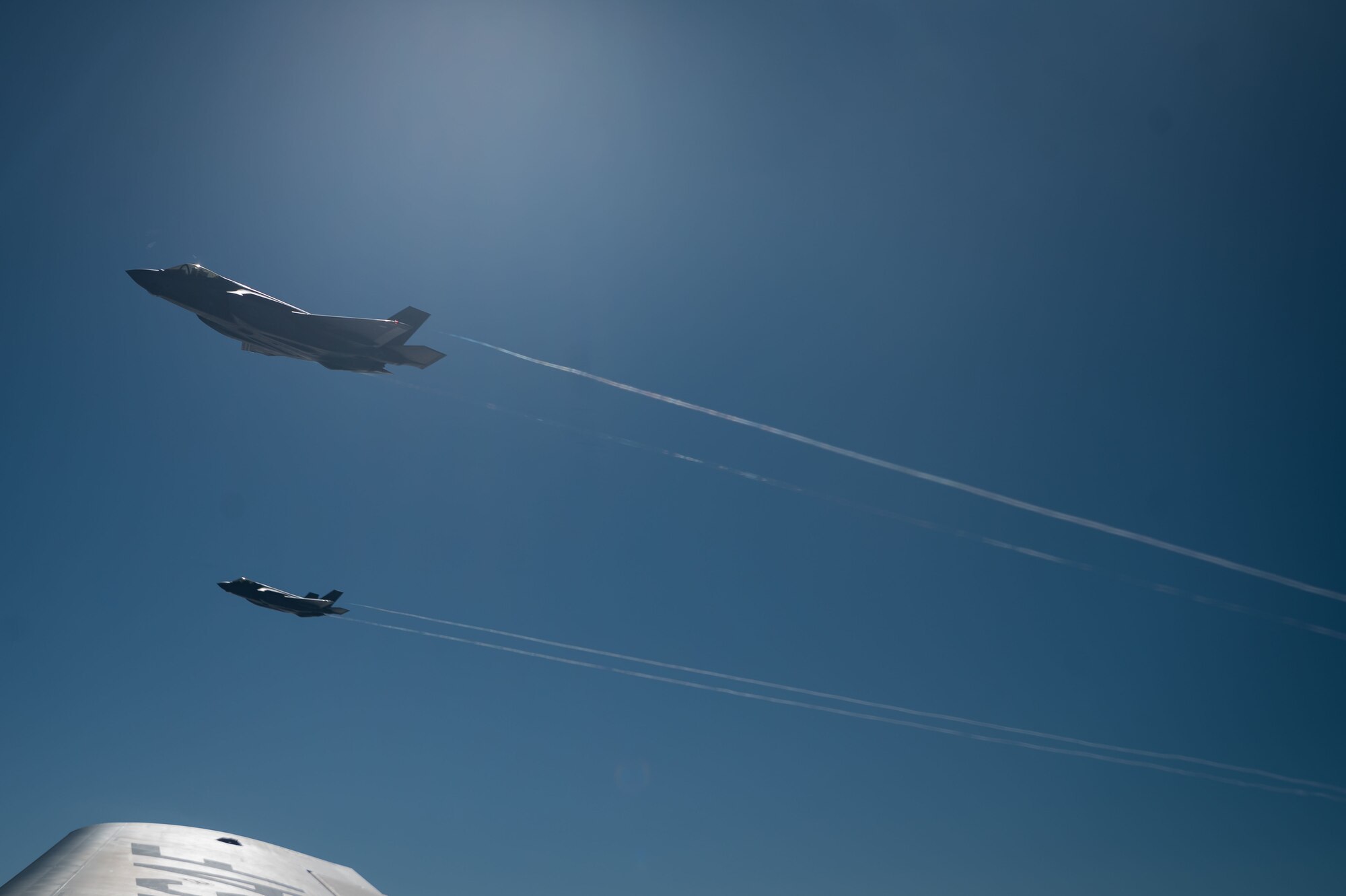 Two U.S. Air Force F-35A Lightning IIs from the 48th Fighter Wing at RAF Lakenheath, fly next to a KC-135 Stratotanker from the 100th Air Refueling Wing, during exercise Cobra Warrior over the North Sea, Sept. 16, 2025.