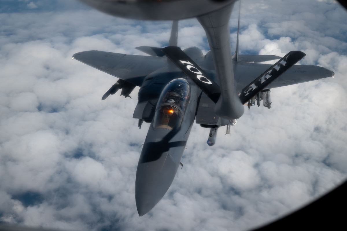 U.S. Air Force F-15E Strike Eagle from the 48th Fighter Wing, RAF Lakenheath, approaches a KC-135 Stratotanker from the 100th Air Refueling Wing at RAF Mildenhall, over the North Sea, Sept. 16, 2025.