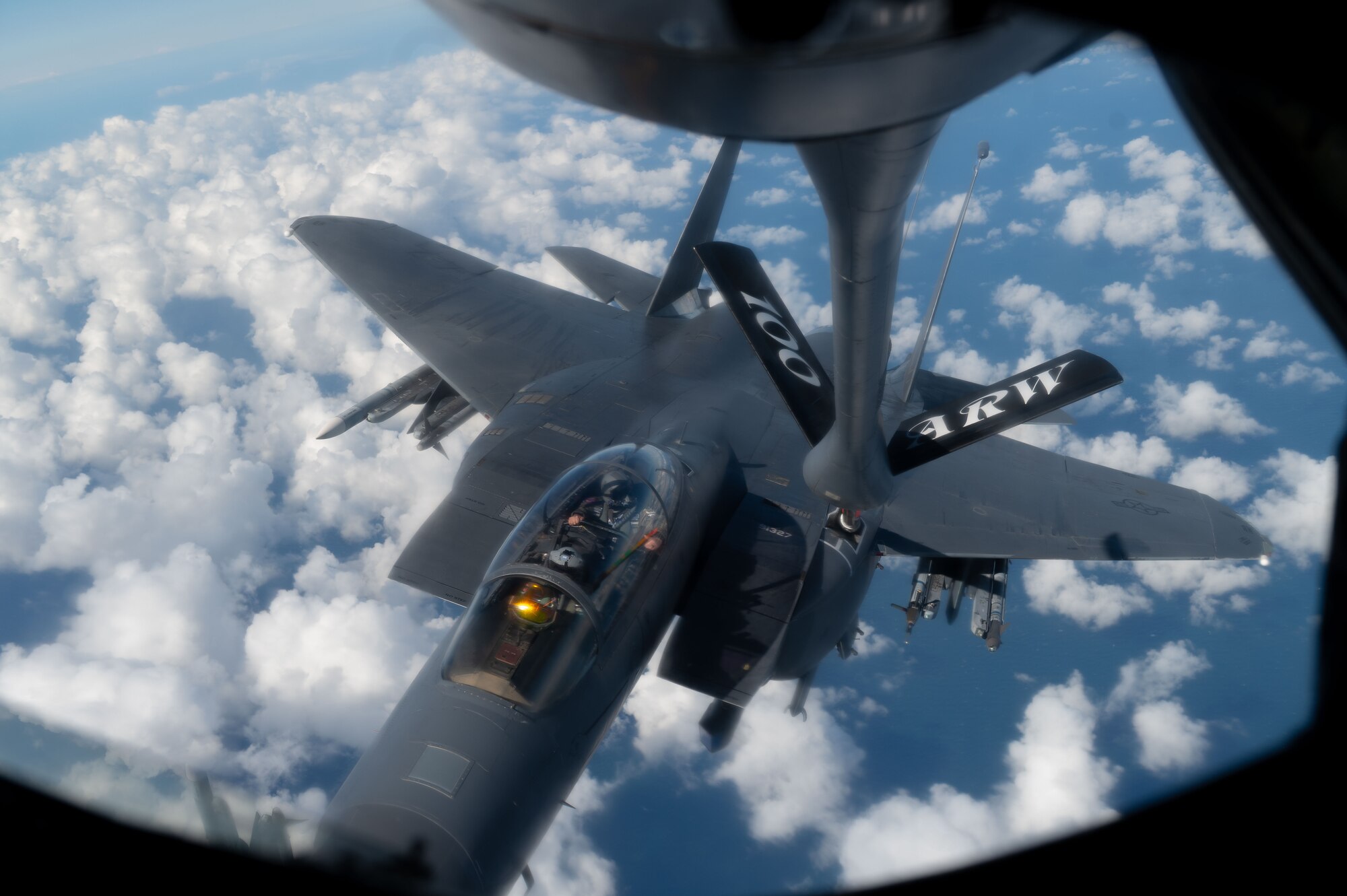 U.S. Air Force F-15E Strike Eagle from the 48th Fighter Wing, RAF Lakenheath, approaches a KC-135 Stratotanker from the 100th Air Refueling Wing at RAF Mildenhall, over the North Sea, Sept. 16, 2025.