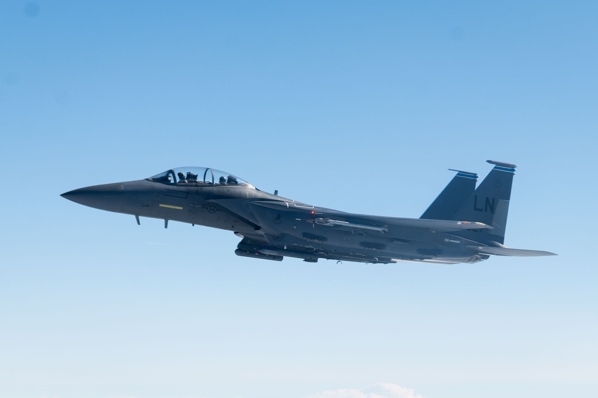 A U.S. Air Force F-15 Eagle from the 48th Fighter Wing flies beside a KC-135 Stratotanker from the 100th Air Refueling Wing after receiving fuel during exercise Cobra Warrior, over the North Sea, Sept. 16, 2025.