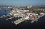 Aerial view of Coast Guard Yard in Baltimore. The Coast Guard awarded a contract for the reconstruction of Pier 1 (first from the left) on Sept. 9, 2025, to support future depot-level maintenance of the offshore patrol cutter class. (U.S. Coast Guard photo)