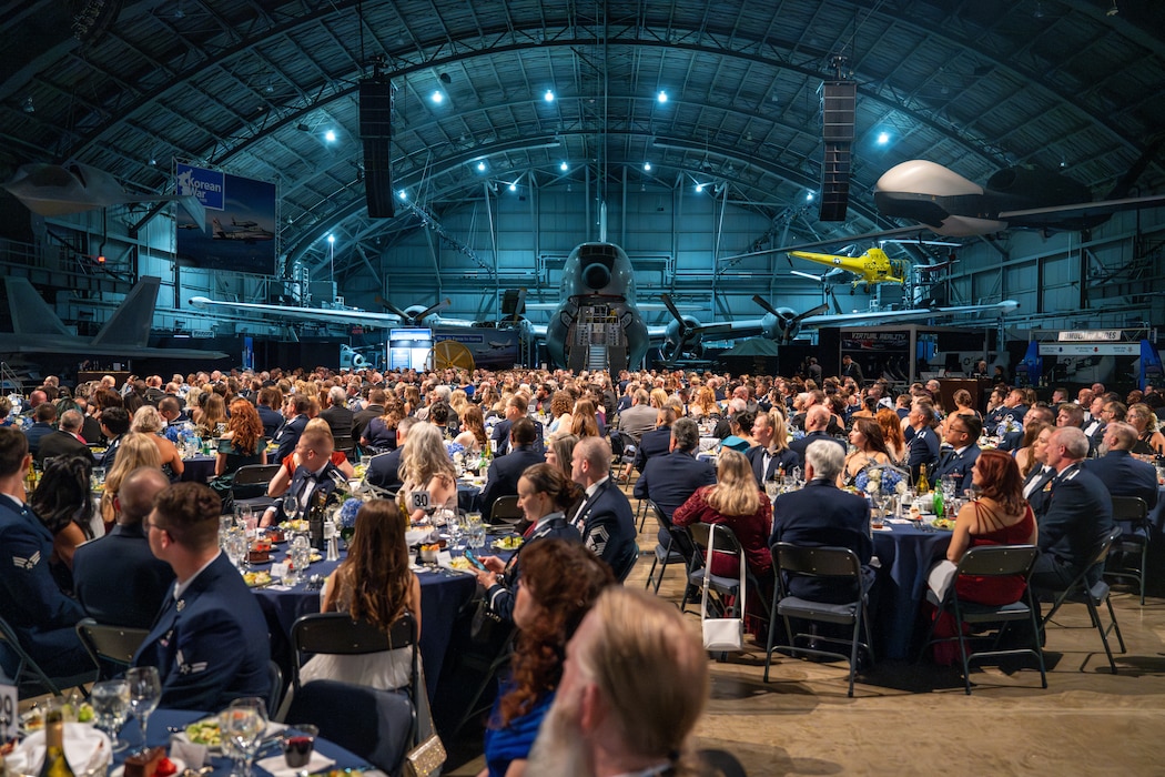Attendees of the annual Wright-Patterson Air Force Ball enjoy dinner and conversation at the National Museum of the United States Air Force, Sept. 13, 2025. The event also featured a performance by the Air Force Band of Flight and an awards ceremony. (U.S. Air Force photo by Jack Gardner)