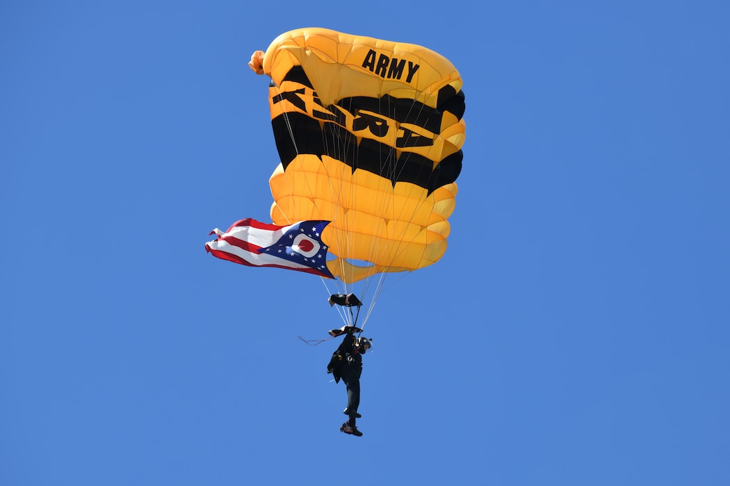 A member of the U.S. Army Golden Knights performs a parachute jump carrying the state of Ohio pennant during the 2025 Cleveland National Air Show, held at Burke Lakefront Airport, Sept. 1, 2025.