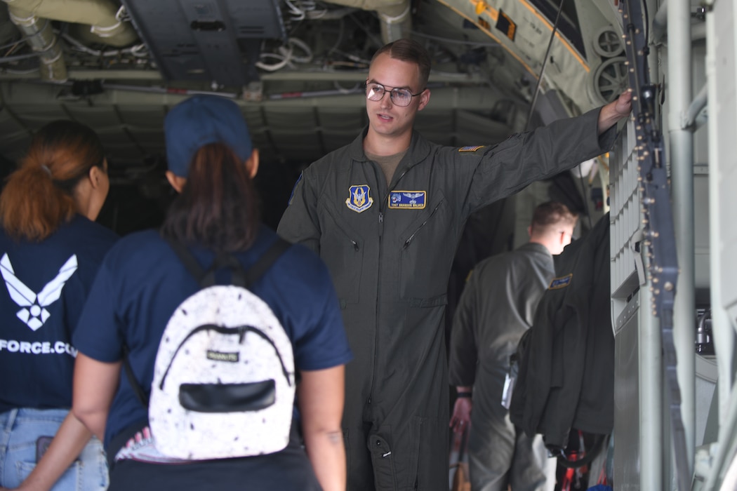 Air Force Reservist Tech. Sgt. Brandon Walker, a loadmaster with the 757th Airlift Squadron, talks with guests aboard the 910th Airlift Wing’s first C-130J-30 Super Hercules aircraft, based at nearby Youngstown Air Reserve Station, Ohio, which is featured as a static display during the 2025 Cleveland National Air Show, held at Burke Lakefront Airport, Aug. 30, 2025.