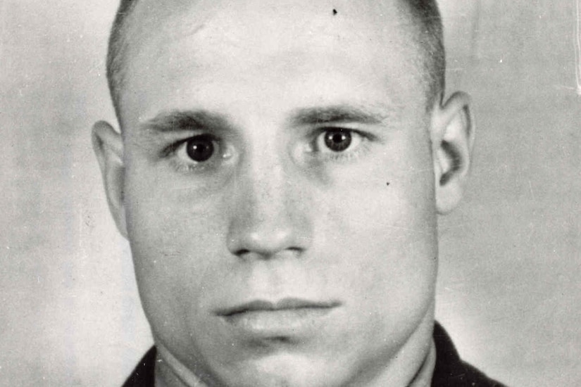 A man looks stoically at the camera for a photo.