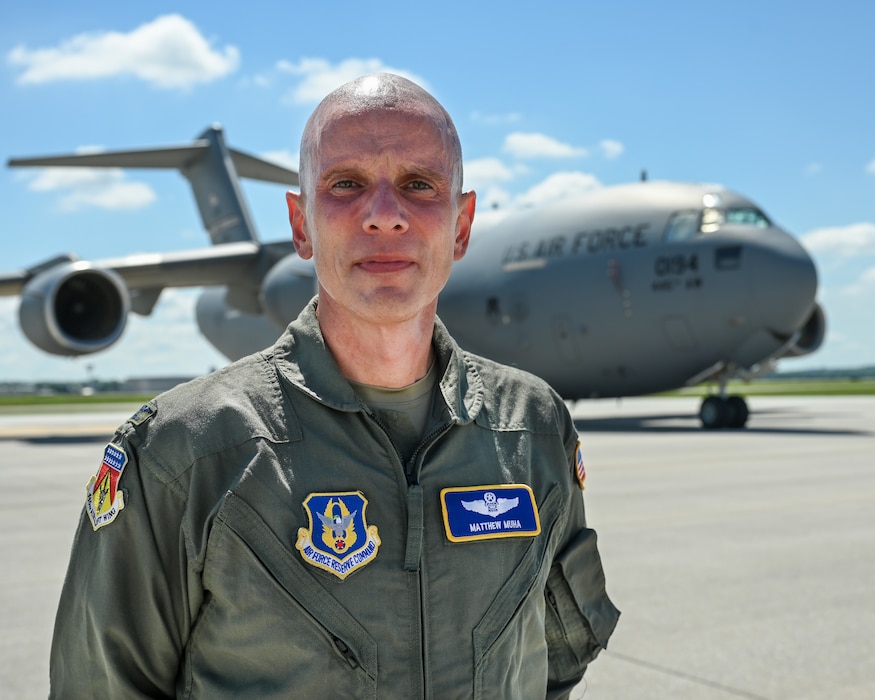 U.S. Air Force Col. Matthew Muha, 445th Airlift Wing deputy commander, stands in front of a C-17 Globemaster III aircraft at Wright-Patterson Air Force Base, Ohio, Aug. 18, 2025. Muha is spearheading Operation Honor, a three-day event at Wright-Patterson that culminates with Honor Flight Dayton where the wing will fly roughly 150 U.S. military veterans to Washington, D.C. and back. (U.S. Air Force photo by Staff Sgt. Johnathan Quiñones)