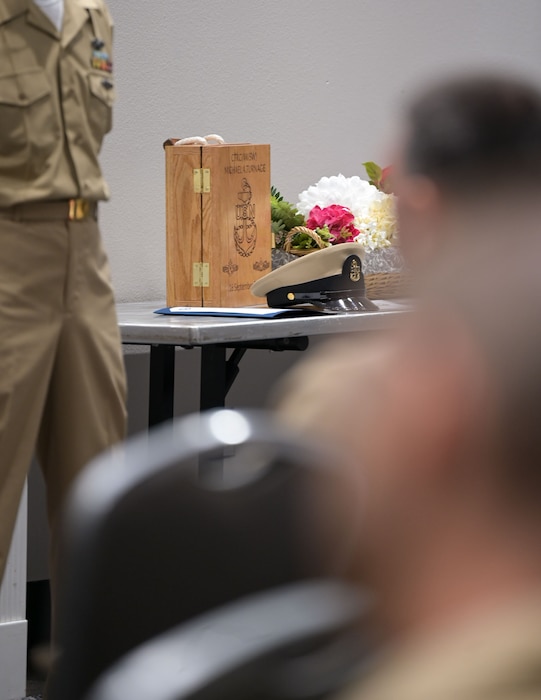 A chief petty officer cover is displayed during the Fiscal Year 2026 Chief Petty Officer Pinning Ceremony at the Powell Event Center, Goodfellow Air Force Base, Texas, Sept. 16, 2025. The rank of chief petty officer is seen as a significant milestone in an enlisted Sailor’s career. With the advancement comes an increased responsibility of taking charge and training Sailors. (U.S. Air Force photo by Senior Airman Evelyn J. D’Errico)