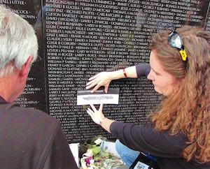 Al Bailey, left, Honor Flight Dayton president, and Kelley Cox, right, Honor Flight Dayton board member, conduct a rubbing of Steve Moseley during the Honor Flight Dayton’s Honoring Yesterday’s Heroes Program at the Vietnam Wall in Washington, D.C., 2014. Bailey and Moseley were friends in the service who trained, went to Vietnam and were set to redeploy together. Unfortunately, Moseley was killed in action Dec. 12, 1967, two weeks before he was scheduled to return home. (Courtesy photo from Bailey)
