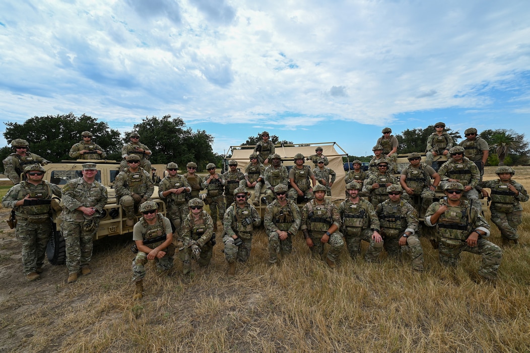 433rd Contingency Response Squadron members posed for a group photo after they trained on airfield setup, security force integration, and equipment deployment at the 433rd Airlift Wing flightline here August 4, 2025.